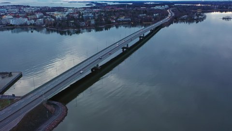 Aerial drone view overlooking cars on road 51, cloudy fall day, in Helsinki