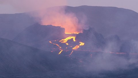4k and slowmotion shots of the icelandic volcano erupting.