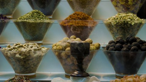 4k shot of a variety of colorful Arabic spices and herbs on the Arab street market stall. Grand Spice Souk or Old Souq in Dubai, United Arab Emirates.