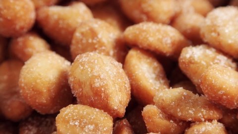 Dry roasted honey coated peanuts extreme close up rotating very slowly stock footage