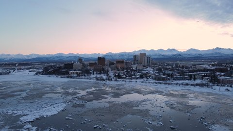 Aerial view of Anchorage Alaska in the winter during sunrise. High quality 4k footage
