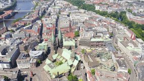Inscription on video. Bremen, Germany. The historic part of Bremen, the old town. Bremen Cathedral ( St. Petri Dom Bremen ). View in flight. Flames with dark fire, Aerial View, Point of interest