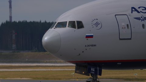MOSCOW, RUSSIAN FEDERATION - JULY 29, 2021: Close shot, Boeing 777 Aeroflot on the airfield on a summer day, Sheremetyevo airport (SVO). Russian company Aeroflot boeing 777 closeup shot