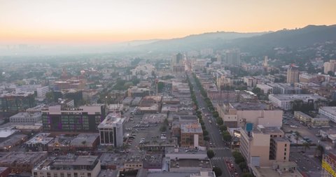 Los Angeles CA  USA - nov 2021: Sunset on Hollywood Walk of Fame seen from above in Los Angeles, Drone motion backwards