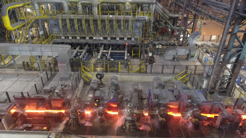 Metal production process in a metallurgical factory. Modern metallurgical factory. Red hot metal in a modern factory. | Shutterstock HD Video #1085735585