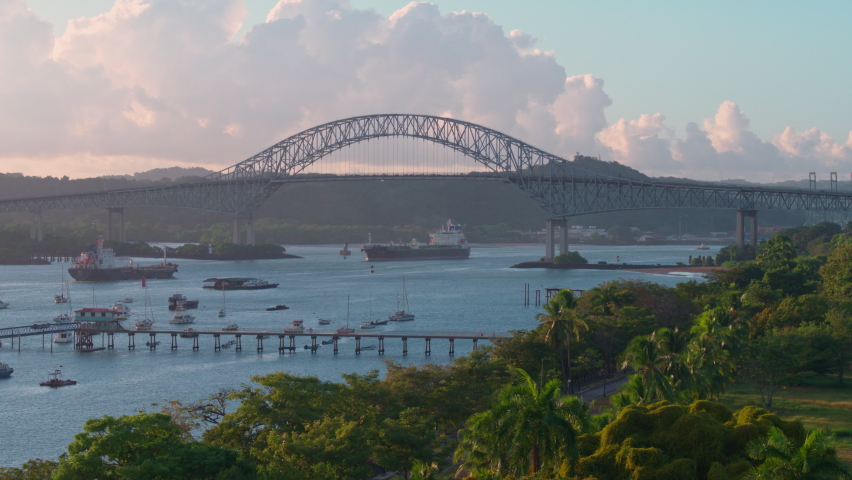 Aerial view of the bridge of americas with ships in the ocean, pullback wide shot Royalty-Free Stock Footage #1085743157