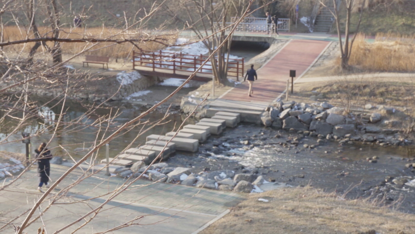 stone bridge in a park for pedestrians