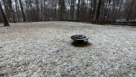 backyard at the beginning of a snow fall in February