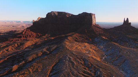 4K aerial footage of powerful place for Native American Indian tribes, inspirational travel background with text space. Monument valley, Utah USA. Cinematic red desert landscape rocky sandstone cliffs
