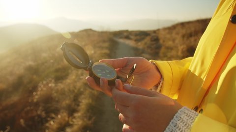 Young Woman Holds A Compass In Her Hand Traveling In The Autumn Mountains Looking For A Way Morning Sunrise Or Sunset Discovering Passions And Walking Reaching Peaks Influencer On Leave