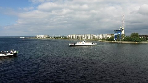 Ferries crossing from Warnemunde to Rostock , Germany