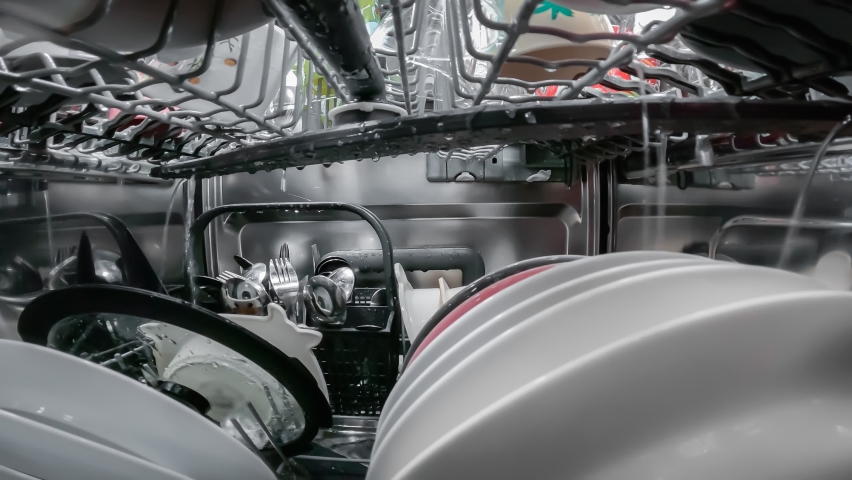 Washing dishes process inside the dishwasher | Shutterstock HD Video #1085756891