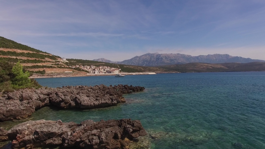 Drone view of Lustica Bay with clear water