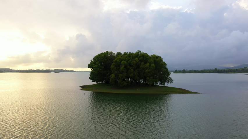 Trees Growing In The Islet At Vaitarna Lake And Dam At Dusk In Maharashtra, India. - aerial