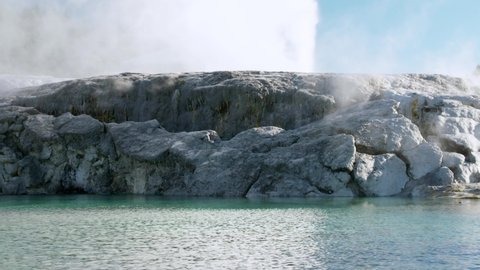 Geyser shooting boiling hot water steam meters into air, Rotorua