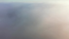 Gorgeous view of the valley covered with fluffy thick fog. Footage from a bird's eye view. Dniester canyon, Ukraine, Europe. Cinematic drone shot. Filmed UHD 4k video. Discover the beauty of earth.