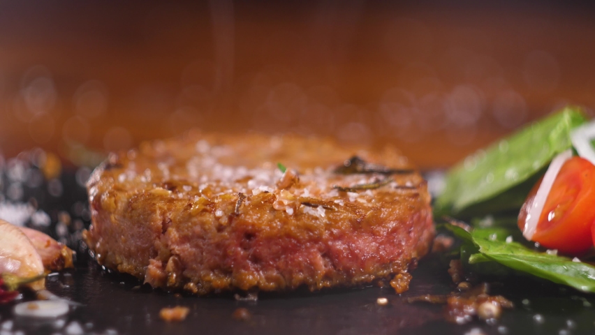 Plant based vegan burger meat, fake vegeterian beef meat close up, fresh impossible veggie food, beyond meat