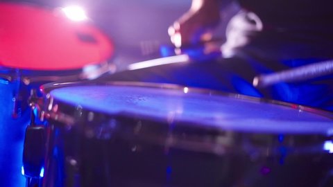 Drummer man playing drums nightclub