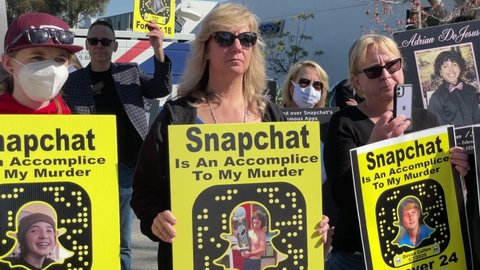 People rally outside Snapchat headquarters to demand tougher restrictions on the popular social media app following fatal overdoses from powerful opioid fentanyl, in Santa Monica, Calif. Jan.21, 2022.
