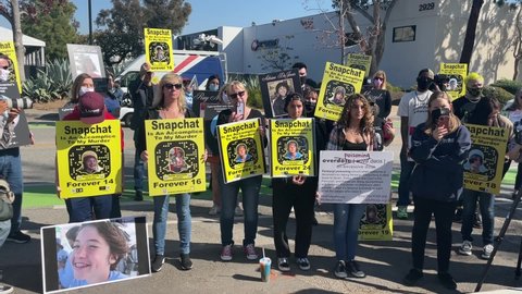 People rally outside Snapchat headquarters to demand tougher restrictions on the popular social media app following fatal overdoses from powerful opioid fentanyl, in Santa Monica, Calif. Jan.21, 2022.