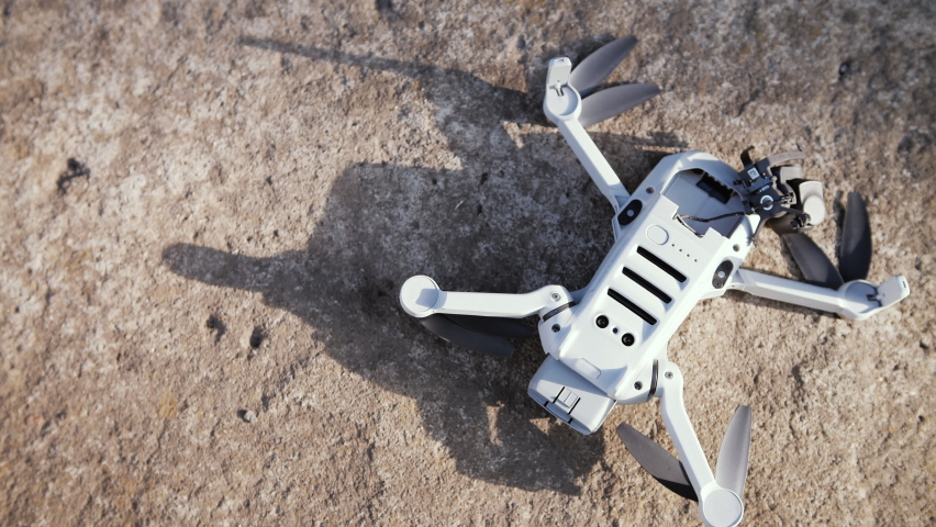 Ultralight quadcopter smashed on the rocks | Shutterstock HD Video #1085771855