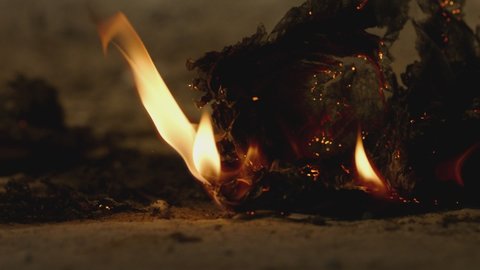 Fire Flames Igniting And Burning . Burning papers . Burning hot bonfire . Flying fire sparks . Paper burn on the floor  Shot on ARRI ALEXA Cinema Camera in Slow Motion .
