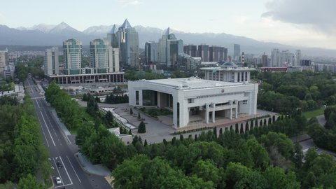 Almaty, Kazakhstan - May 7, 2020: Almaty city hall and residence of the President on a sunny day at sunset. City administration building on a spring bright day. Aerial shot of the Almaty akimat.