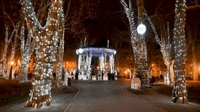 Zagreb, Croatia: Christmas lights decorations. Illuminated Christmas market in city centre at night. Advent in Zagreb. Decorated trees in park. - Powered by Shutterstock - Get 15% off with code: PIKWIZARD15