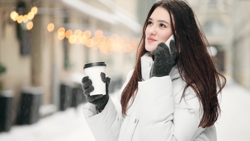 Portrait of attractive young woman using mobile phone. Positive woman with smartphone have a phone call.