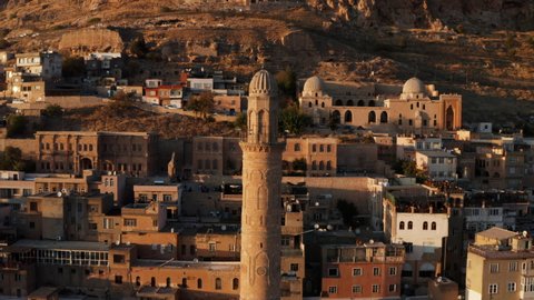 The Historical City Of Mardin With Grand Mosque Minaret During Sunset In Turkey. Aerial Pullback