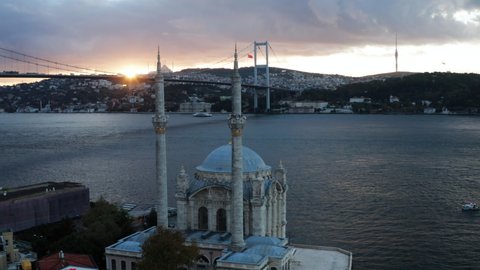 Ortakoy Mosque With Bosphorus Bridge In Istanbul At Sunrise - aerial drone shot