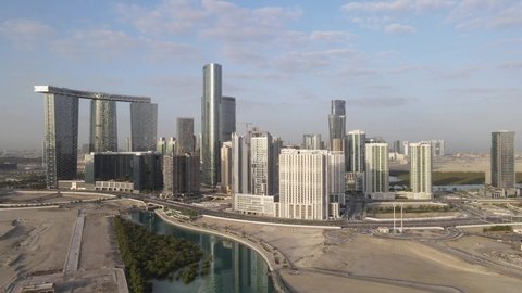 Abu Dhabi, UAE - January 9, 2022: Aerial view on developing part of Al Reem island in Abu Dhabi on a cloudy morning. Drone footage.