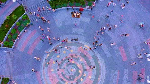 30 July 2021 - Kyiv, Ukraine: Crowd of People listens to Street Musician at square on summer evening: Aerial Drone shot. Crowd of People in the Street Watches Performance of Drummer After Quarantine.
