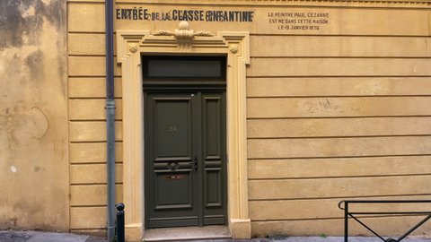 Aix-en-Provence, France - August 2021 : entrance door of the birthplace of famous painter Paul Cezanne in the Rue de l'Opera street in Aix en Provence, France