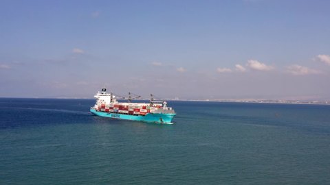 Haifa, Israel - October 25, 2021: Maersk Container ship at sea approaching a commercial port.