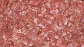Food texture. Close-up macro shot 4k stock video footage of fresh organic pink mincemeat (chopped or ground or minced meat). Protein ingredient for cooking healthy meal