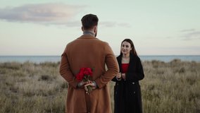Boy Gives Red Roses To Girlfriend for valentines day - Powered by Shutterstock - Get 15% off with code: PIKWIZARD15