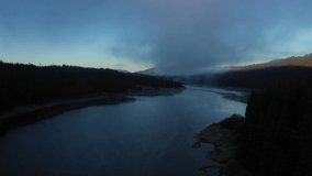 Flying over a lake in misty dawn lights in early morning. Aerial drone view - Powered by Shutterstock - Get 15% off with code: PIKWIZARD15