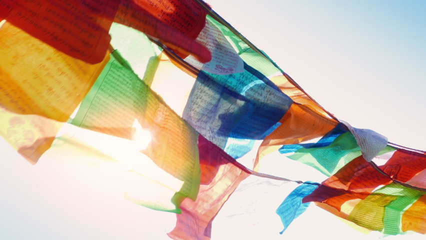 Prayer Flags With Sun Shining Through In The Wind