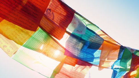 Prayer Flags With Sun Shining Through In The Wind