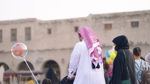 Doha - Qatar - november 2021 - Qatari families walking in front Souq Waqif in Doha Qatar
