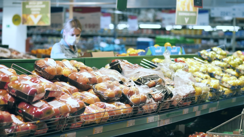 Women in face masks are shopping in the fruit section - Powered by Shutterstock - Get 15% off with code: PIKWIZARD15