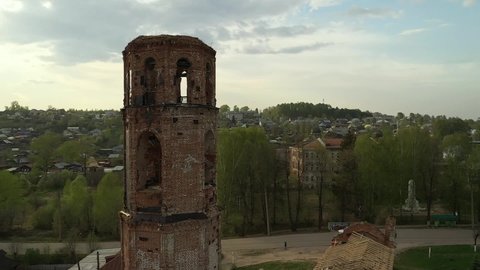 Tower of abandoned brick church in small town