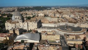 Aerial drone video of world's largest church -Basilica of St. Peter's, Vatican and iconic Capella Sistine, Rome, Italy