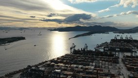 Aerial drone video of industrial loadin - unloading logistics container terminal area of Perama, Piraeus port, Attica, Greece