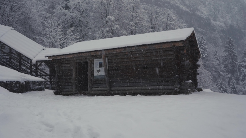 Cabin in the mountains during a snowfall in January. Hallstatt, Upper Austria, Austria. 