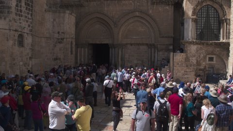 Tourists in the courtyard of the Church of the Holy Sepulchre, waiting to view the shrine from the inside, Jerusalem, Israel - 6 may 2021
