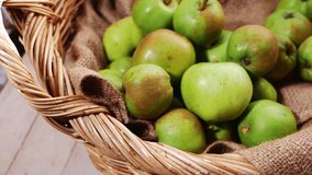 Apples for baking in vintage woven basket medium panning shot selective focus - Powered by Shutterstock - Get 15% off with code: PIKWIZARD15