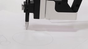 A robotic machine that draws and creates a picture on canvas.