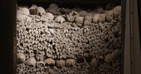 Paris, France - January 12 2022: Close-up shot of human skulls and bones in the underground of Paris